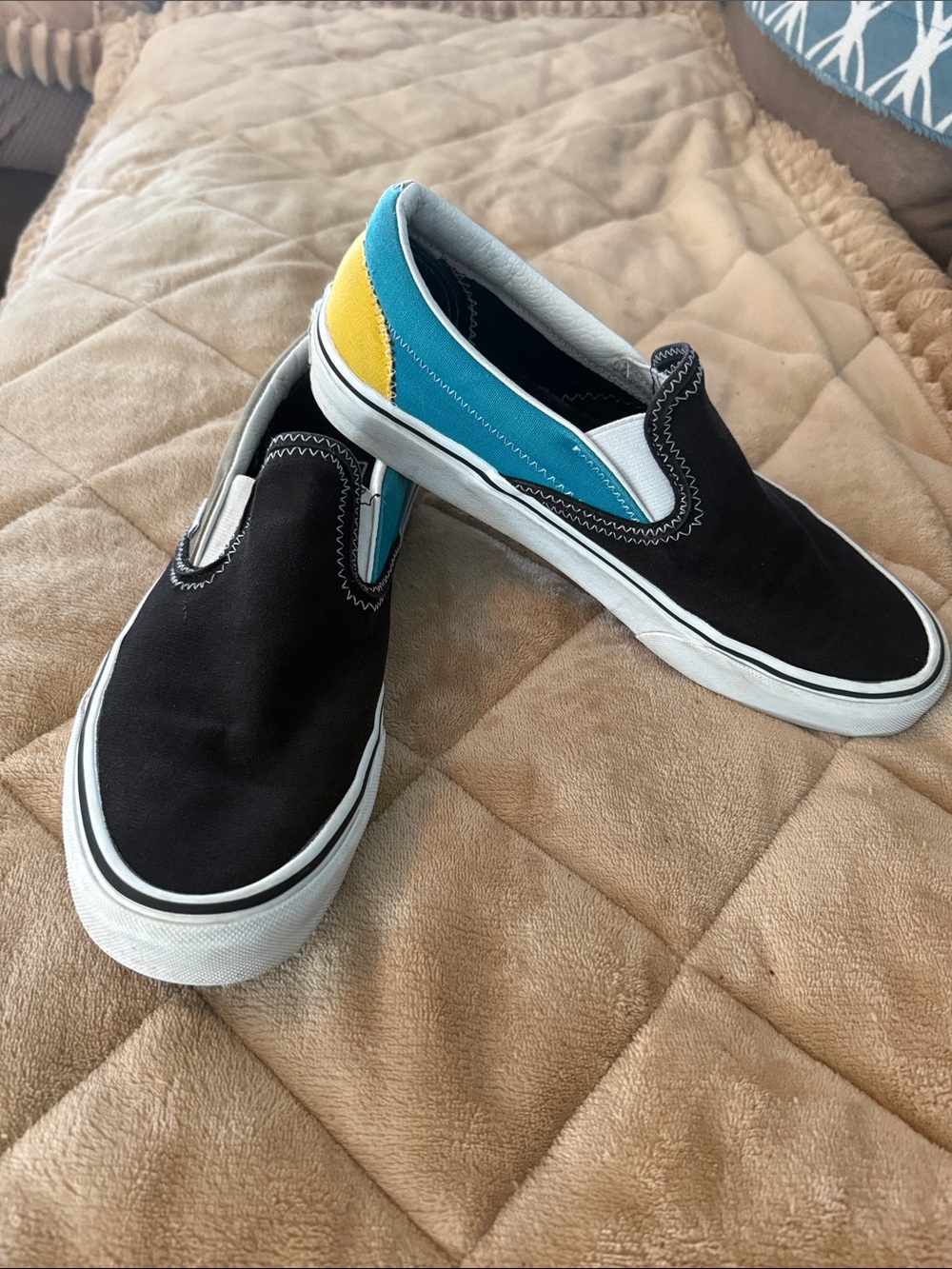 Vans unisex Slip-On Sneakers in Black with Blue, green and Yellow Accents